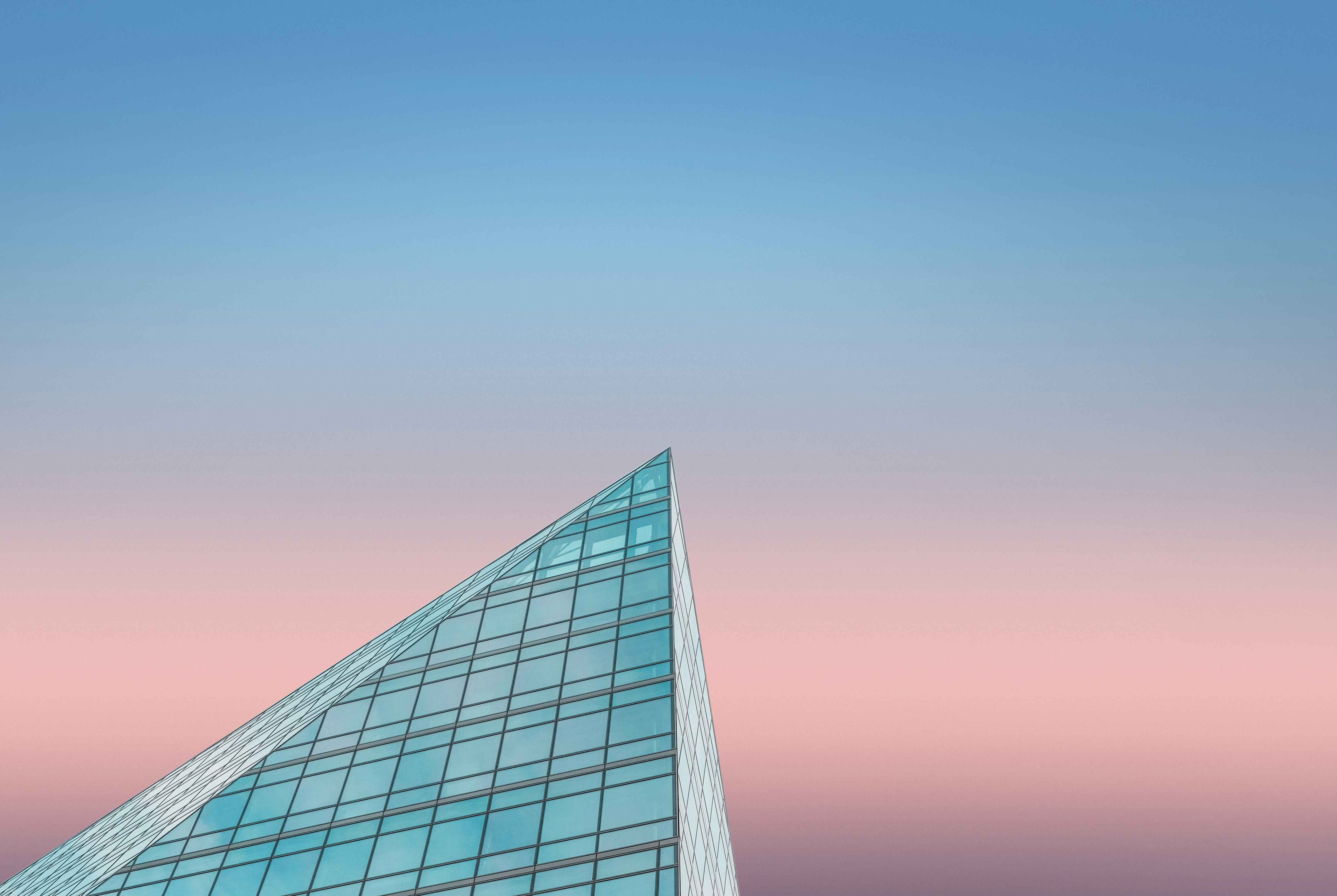 black glass building under blue sky